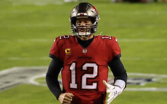 Jan 9, 2021; Landover, Maryland, USA; Tampa Bay Buccaneers quarterback Tom Brady (12) jogs onto the field prior to the Buccaneers' game against the Washington Football Team at FedExField. Mandatory Credit: Geoff Burke-USA TODAY Sports/Sipa USA