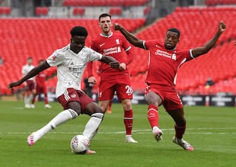 LONDON, ENGLAND - AUGUST 29: Bukayo Saka of Arsenal takes on Georginio Wijnaldum of Liverpool during the Community Shield after the FA Community Shield match between Arsenal and Liverpool at Wembley Stadium on August 29, 2020 in London, England. (Photo by Stuart MacFarlane/Arsenal FC via Getty Images)