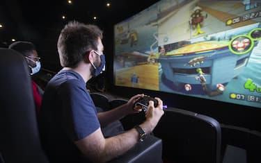 EDITORIAL USE ONLY Gaming influencer Rhys Farrant, known online as Gameasertm, plays Xbox on the big screen at Cineworld Leicester Square in London, as the cinema announces private screen hire for gaming fans at 100 different venues across the UK. Issue date: Thursday May 20, 2021.
