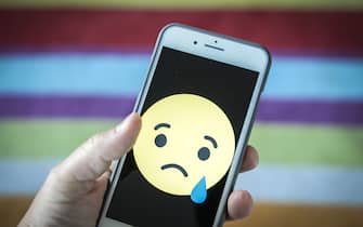 A sad face emoticon is seen on an iPhone in this photo illustration on May 25, 2018. (Photo by Jaap Arriens/NurPhoto via Getty Images)