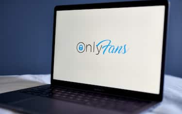 The OnlyFans logo on a laptop computer arranged in New York, U.S., on Thursday, June 17, 2021. OnlyFans, a site where celebrities and adult-film stars charge admirers for access to videos and photos, is in talks to raise new funding at a company valuation of more than $1 billion, according to people with knowledge of the matter. Photographer: Gabby Jones/Bloomberg