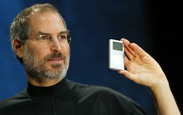 SAN FRANCISCO - JANUARY 6:  Apple CEO Steve Jobs holds a new mini iPod at Macworld January 6, 2004 in San Francisco. Jobs announced several new products including the new iLife 4 software and the Mini iPod. (Photo by Justin Sullivan/Getty Images)