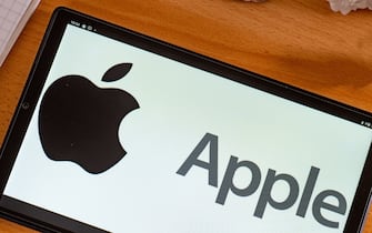In this photo illustration, an Apple Inc. logo seen displayed on a tablet screen. (Photo by Igor Golovniov / SOPA Images/Sipa USA)