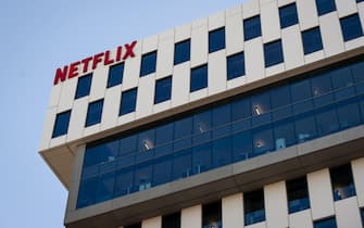 epa07932002 A Netflix logo hangs on the company's headquarters in Los Angeles, California, USA, 18 October 2019. On 17 October 2019 Netflix reported earnings of 1.47 US dollar per share, compared to analysts estimates of 1.05 US dollar per share.  EPA / CHRISTIAN MONTERROSA