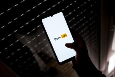 In this photo illustration a PornHub logo seen displayed on a smartphone screen in Athens, Greece on March 16, 2022. (Photo by Nikolas Kokovlis/NurPhoto via Getty Images)