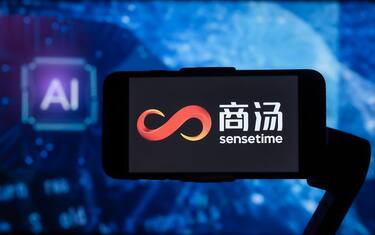 INDIA - 2023/02/17: In this photo illustration, the logo of SenseTime is seen displayed on a mobile phone screen with AI (artificial intelligence) written in the background. (Photo Illustration by Idrees Abbas/SOPA Images/LightRocket via Getty Images)