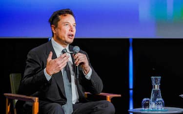 epa10144987 Tesla-founder Elon Musk (L) is watched by moderator Xenia Wicket (R) and an audience as he speaks at a discussion forum during the Offshore Northern Seas (ONS) Conference, in Stavanger, Norway, 29 August 2022. The ONS is taking place from 29 August to 01 September 2022 and brings together international industry executives to discuss on 'the future of the energy industry, including new technologies, new forms of leadership and new business models', as the organizers describes it on their website.  EPA/Carina Johansen NORWAY OUT