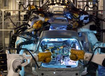WOLFSBURG, Germany: Robots assemble Volkswagen Golf models on an automated production line at VW's headquarters and main manufacturing plant in Wolfsburg 21 September 2005. AFP PHOTO JOHN MACDOUGALL (Photo credit should read JOHN MACDOUGALL/AFP via Getty Images)