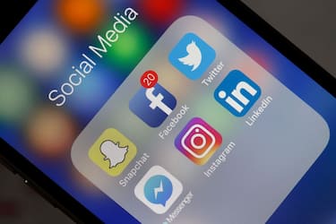 PARIS, FRANCE - MAY 12:  In this photo illustration, logos of the Snapchat, Facebook, Twitter, Messenger, Instagram and LinkedIn applications are displayed on the screen of an Apple iPhone on May 12, 2018 in Paris, France. Faced with the anger of dissatisfied users, the Snapchat application has canceled certain changes, announced at the end of 2017, in the presentation of the application, announced its parent company Snap Friday. Snap, which accumulates the financial losses, announced last November a redesign of this app popular with teenagers to attract new users and advertisers. Snapchat is a free photo and video sharing application available on iOS and Android mobile platforms from Snap Inc. (Photo Illustration by Chesnot/Getty Images)