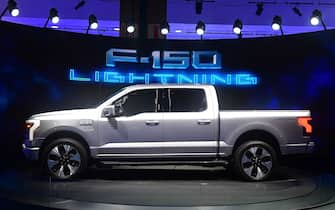 The all-electric F-150 Lightning from Ford is displayed at the Los Angeles Auto Show in Los Angeles, California on November 18, 2021. (Photo by Frederic J. BROWN / AFP) (Photo by FREDERIC J. BROWN/AFP via Getty Images)