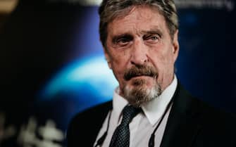 John McAfee, founder of McAfee Associates Inc. and chief cybersecurity visionary at MGT Capital Investments Inc., listens during a Bloomberg Television interview on the sidelines of the Shape the Future: Blockchain Global Summit in Hong Kong, China, on Wednesday, Sept. 20, 2017. McAfee, who now runs a bitcoin mining company, says China's banning of initial coin offerings won't halt the momentum of cryptocurrencies globally. Photographer: Anthony Kwan/Bloomberg