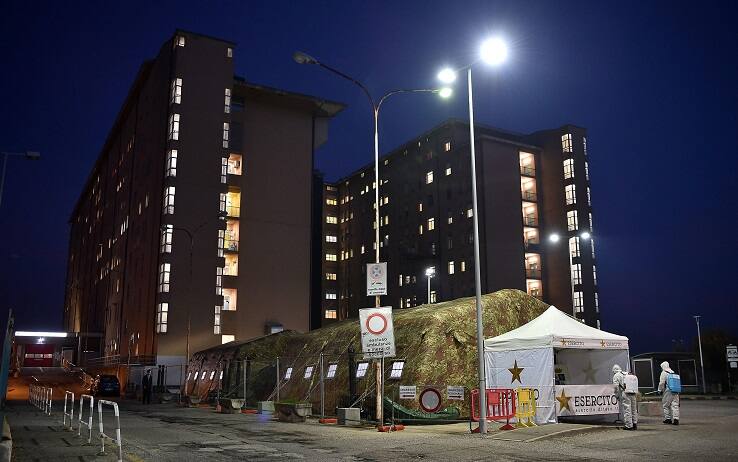 Italian soldiers mount two tents in front of the emergency room of the hospital of Rivoli, common of the first belt of Turin, larger than those prepared last spring, Turin, Italy, 29 October 2020. The two tents will relieve the pressure on the emergency room of the hospital. One will be used as a pre-triage point and will serve to further facilitate access procedures and to better divide the flows between patients Covid-19 and not Covid-19 arriving by ambulance. The other will be used as a waiting room. EPA/ALESSANDRO DI MARCO