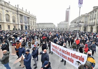 Protest demonstration against the lockdown during the Coronavirus Covid-19 pandemic emergency in Turin, Italy, 15 November 2020. Piedmont is in the red zone with the highest level of restrictions. ANSA/ALESSANDRO DI MARCO