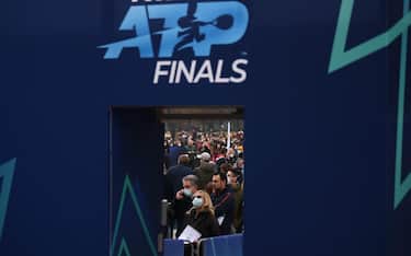 Attendees queue to enter prior the tennis ATP Finals at the Pala Alpitour venue in Turin on November 14, 2021. (Photo by Marco BERTORELLO / AFP)
