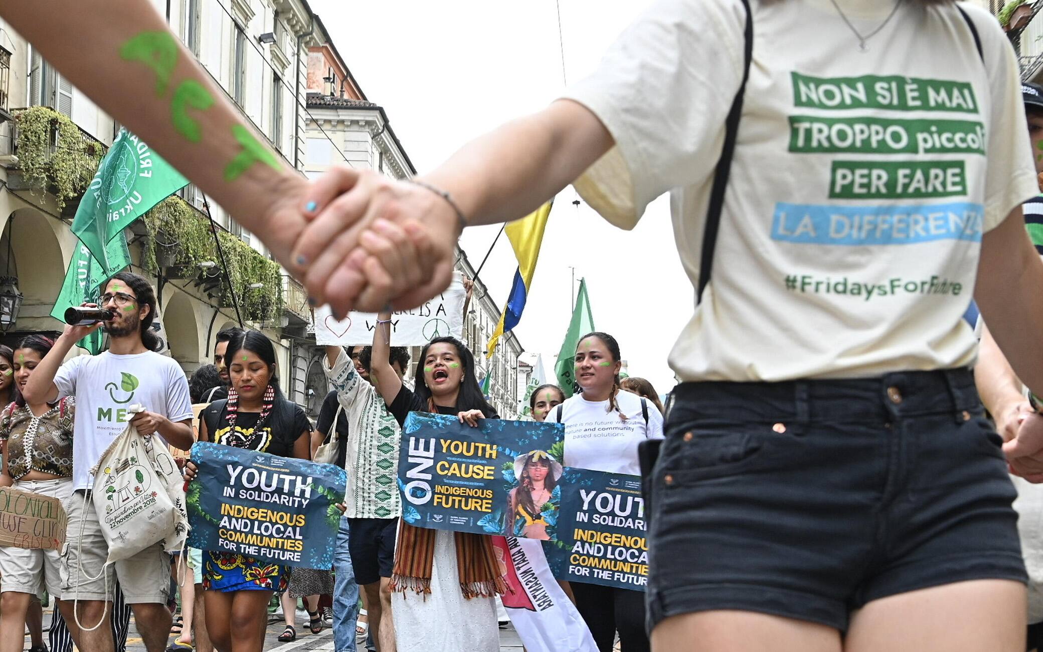 People take part in Fridays for Future march in Turin, Italy, 29 July 2022. 'Join the fight! Time is now' is the title of the event that starts from the Colletta Park and arrives in Vittorio square. ANSA / Alessandro Di Marco